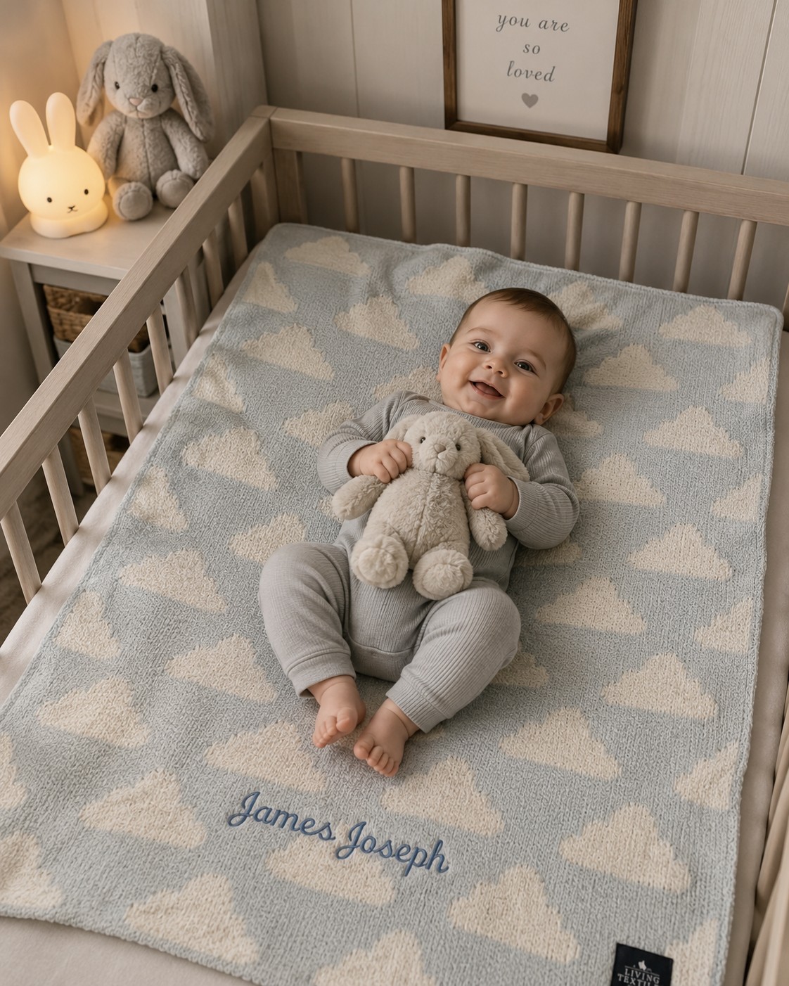 Baby James playing in crib